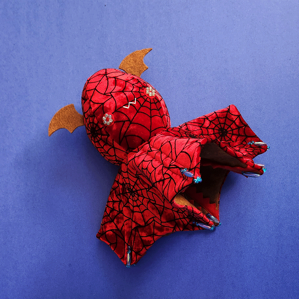soft sculpture Vampire Squid swimming on dark blue background // stop motion animation by Taneko Says Hello