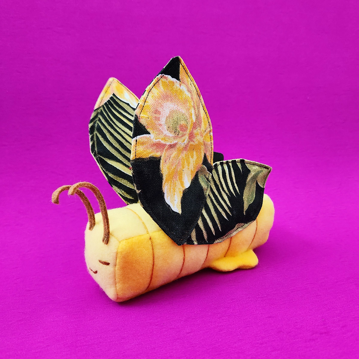 Butter Butterfly plush with dark floral wings by Taneko Says Hello