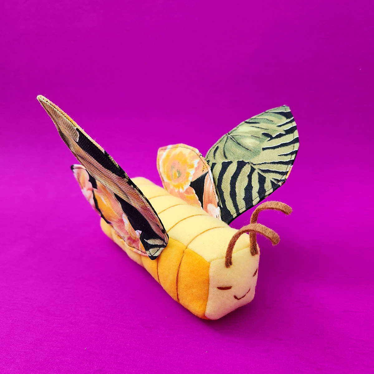 Butter Butterfly plush with dark floral wings by Taneko Says Hello