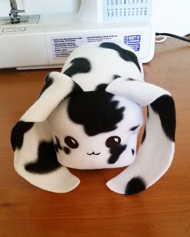 black and white cow print bunny loaf plushie