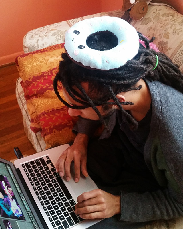 handmade donut plushie sitting on a person's head