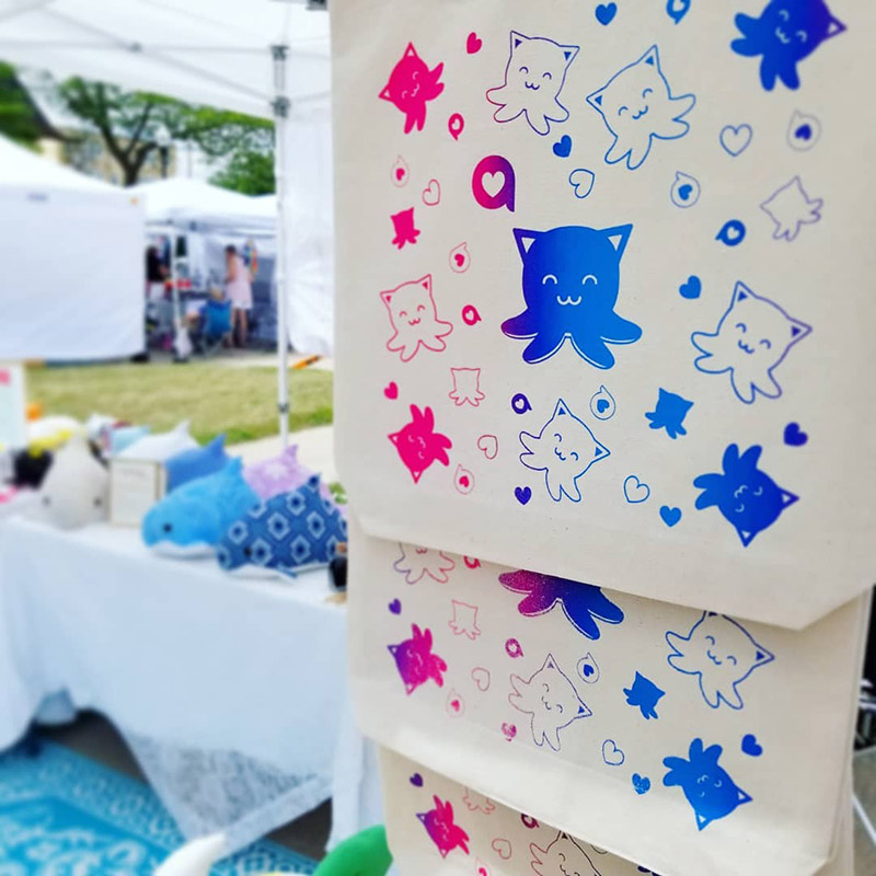 screen printed tote bags featuring pink and blue gradient Taneko design