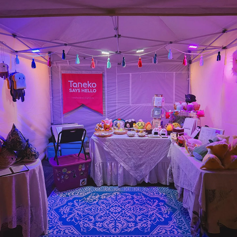 Taneko Says Hello night time booth display at DIY Street Fair