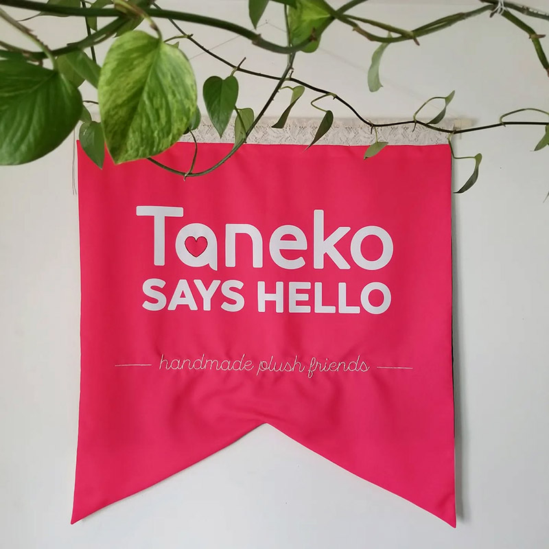 new bright red banner for Taneko Says Hello