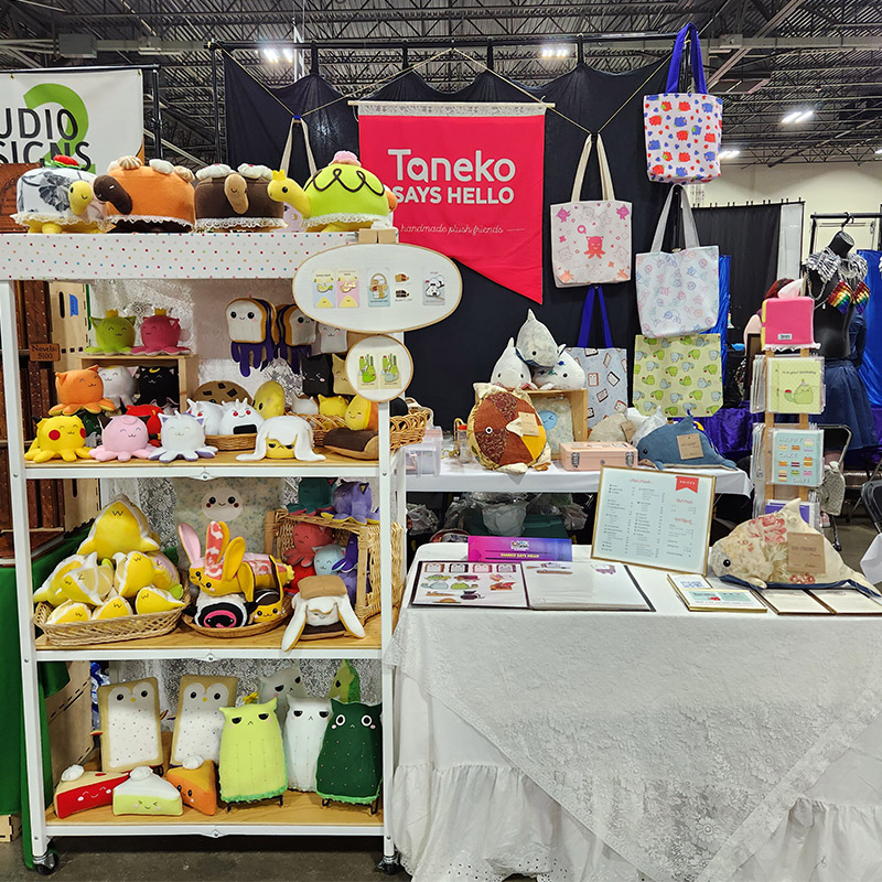 Taneko Says Hello table booth display at Motor City Comic Con