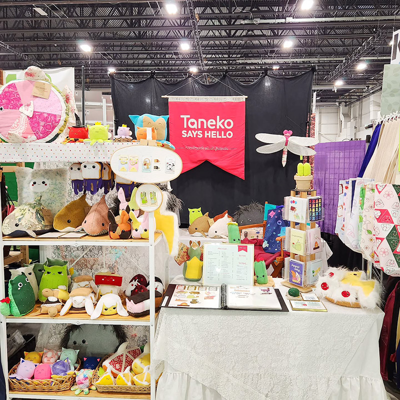Taneko Says Hello table booth display at Motor City Comic Con