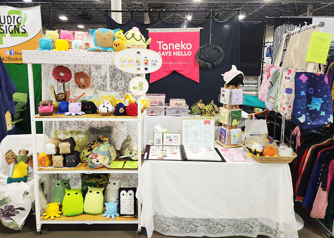 Taneko Says Hello table booth display at Motor City Comic Con