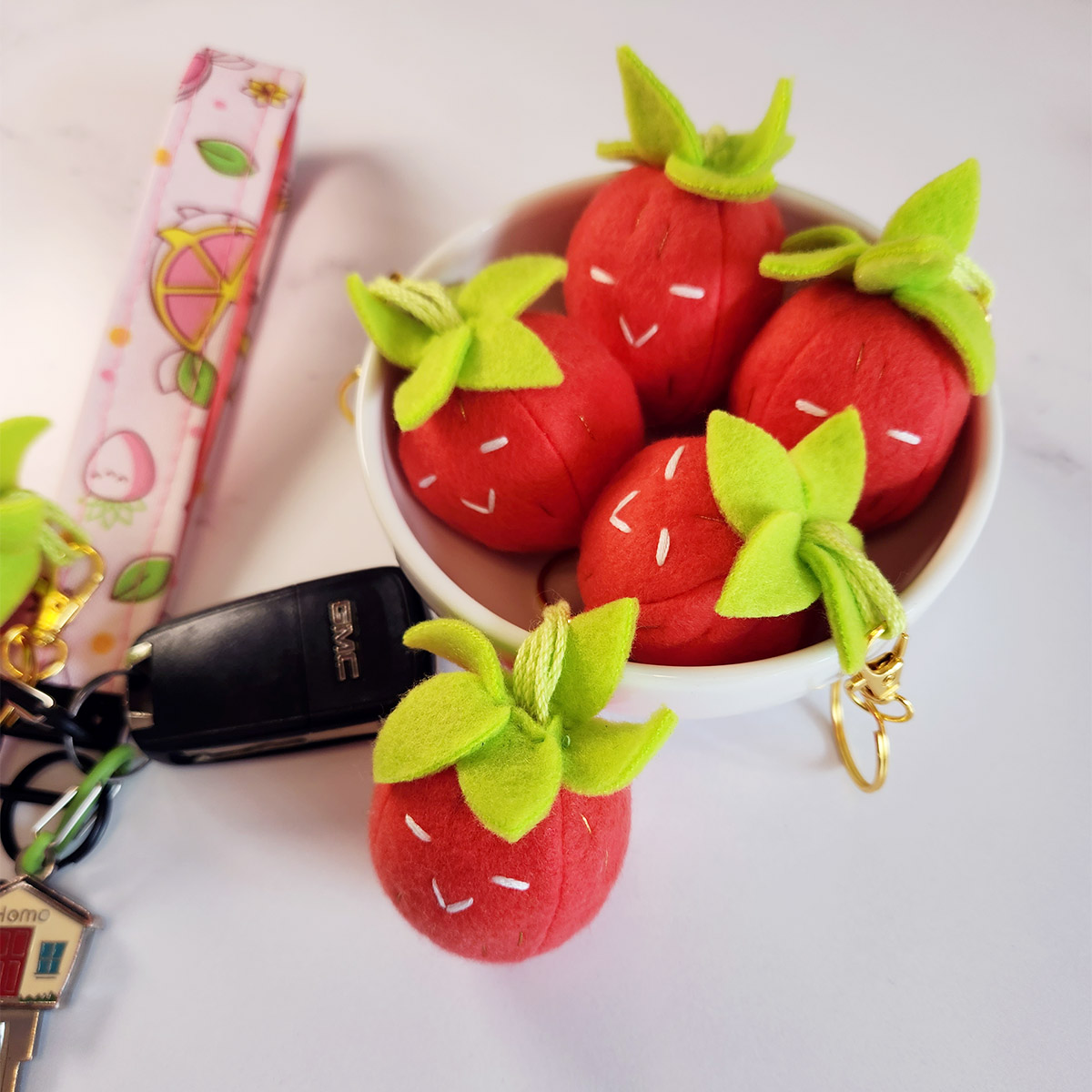 handmade plushie strawberry keychains with pink lanyard // Pure Stitch Magic X Taneko Says Hello