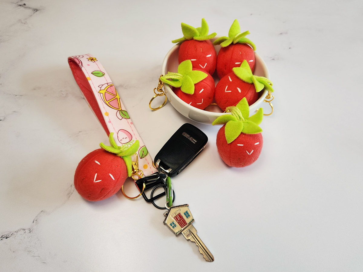 handmade plushie strawberry keychains with pink lanyard // Pure Stitch Magic X Taneko Says Hello