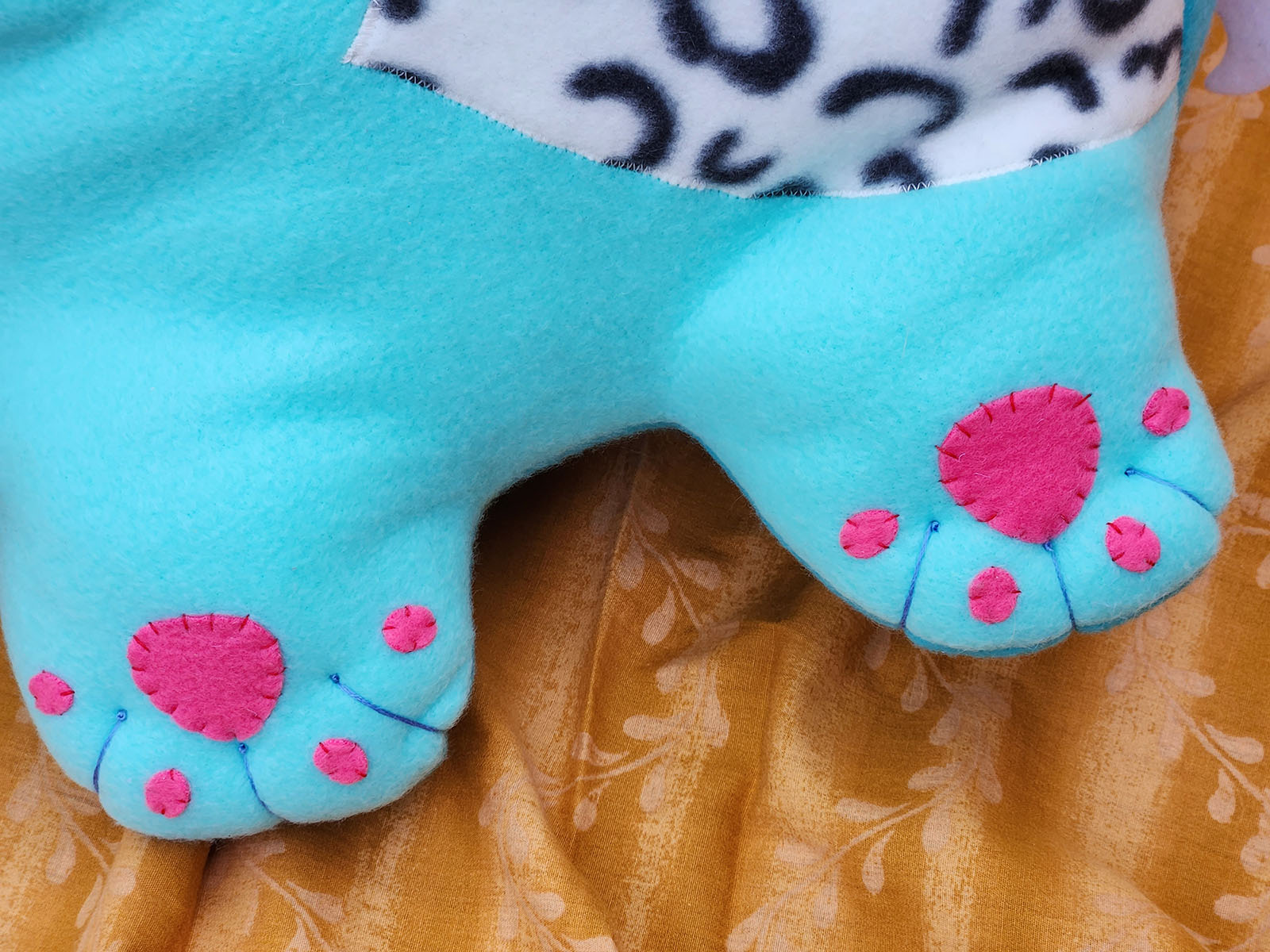 Derpy the Tiger from Kpop Demon Hunters, detail of toe beans // soft sculpture art by Sophia Adalaine